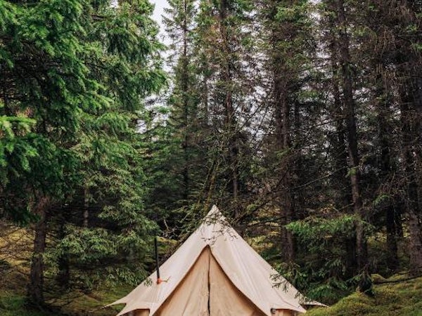 A glamping tent with the door zipped closed at the Golden Circle Tents Glamping Experience.