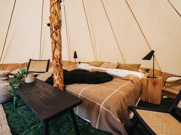 The interior of a glamping tent at the Golden Circle Tents Glamping Experience.