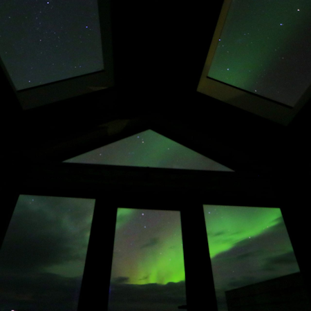 The aurora borealis appear over the Arctic Exclusive Ranch.