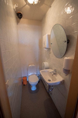 Enjoy the convenience of a refreshingly clean toilet at Hotel Breidavik, contributing to a hygienic and pleasant accommodation e