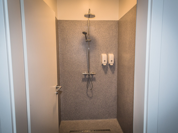 Step into the hostel's shower room, a serene retreat where invigorating showers await after a day of exploration.