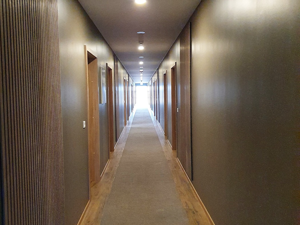 An image of the hallway leading to the rooms at West Ranga Lodge.