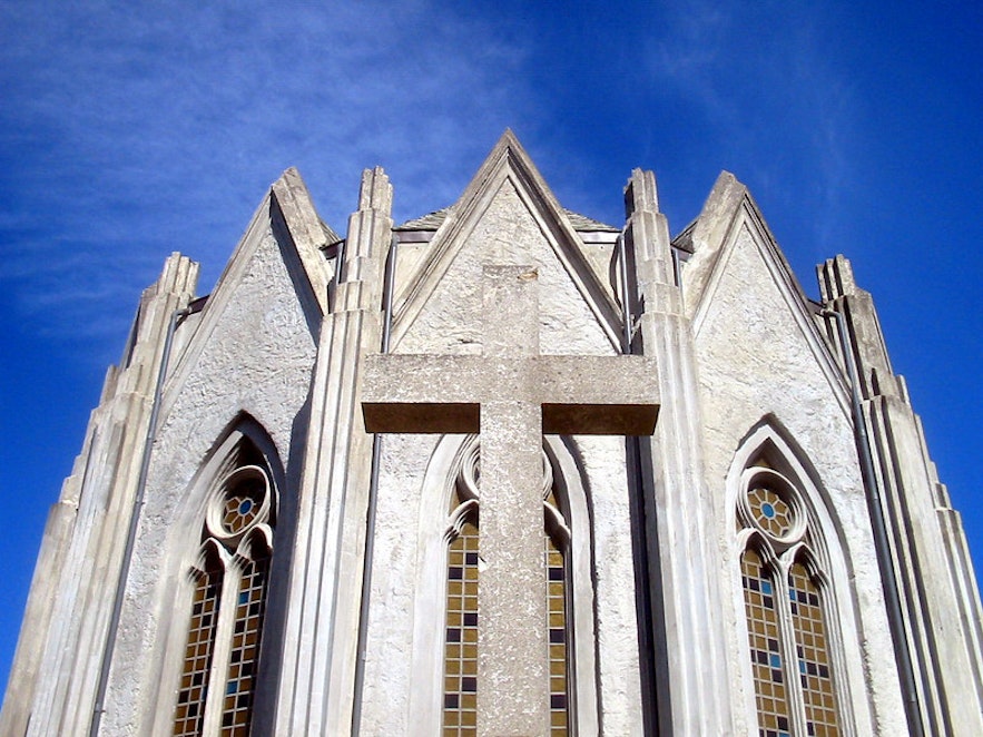 A close-up shot of the Landakotskirkja church in Reykjavik on a clear day.