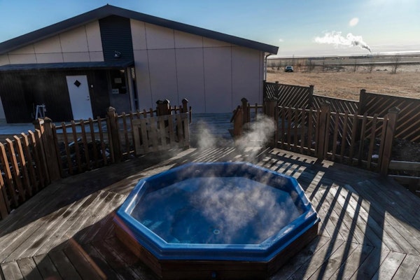 An invitingly warm outdoor hot tub at Hotel Kvika in South Iceland.