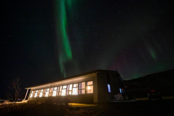 The northern lights adorn the night sky above Hotel Kvika in South Iceland.