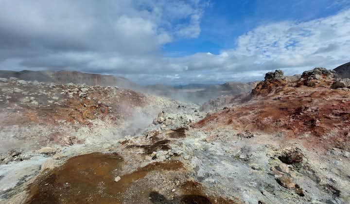 Steam rises from the ground in one of the geothermal areas in Landmannalaugar during summer in Iceland.