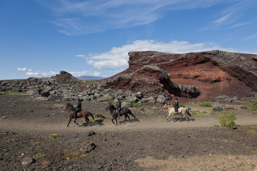Riding through RauÃ°hÃ³lar on Volcanic landscape horse riding tour
