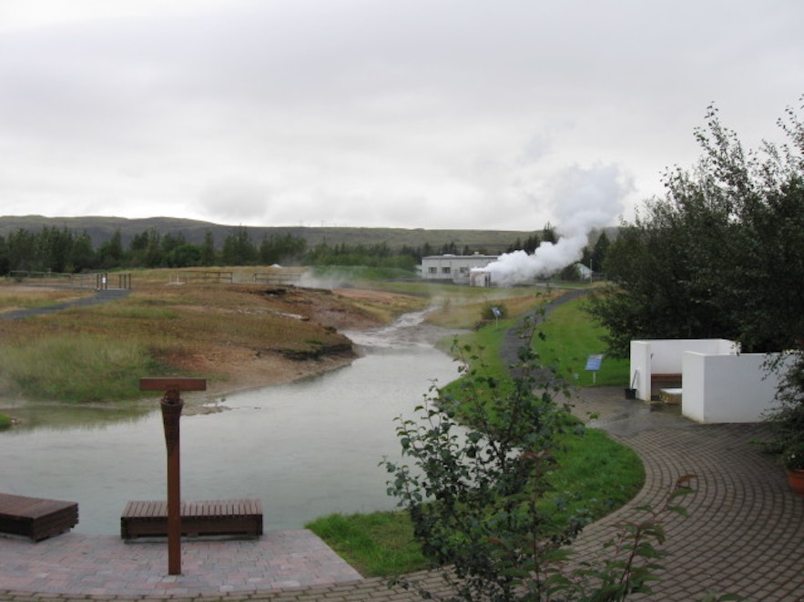 Two benches in front of a hot pool at Hveragerdi Geothermal Park.