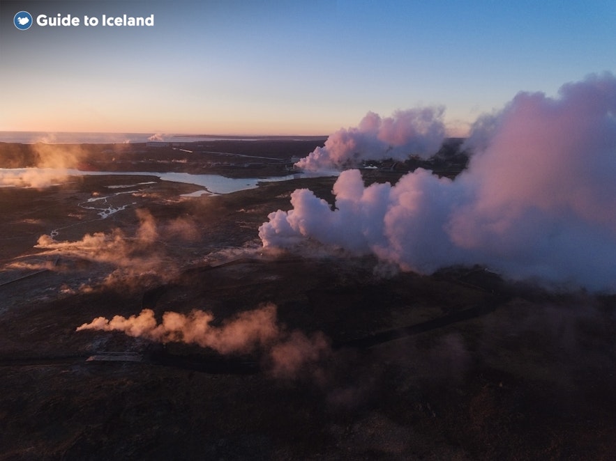 The Reykjanesvirkjun powerplant creates a mystical setting amid a barren landscape.