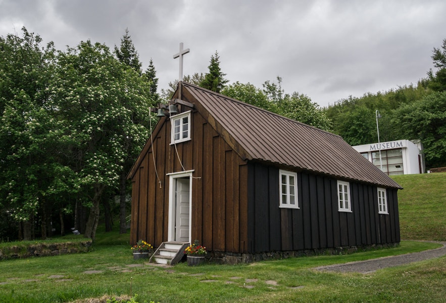 The Akureyri Museum church is located in a lush garden.