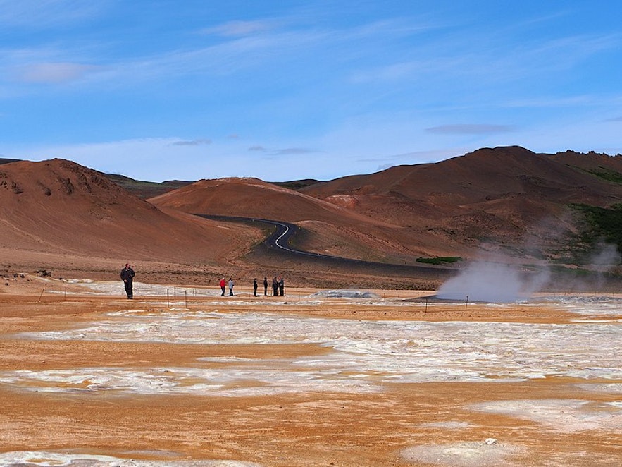 Travelers marvel at the geothermal wonders of Hverir.