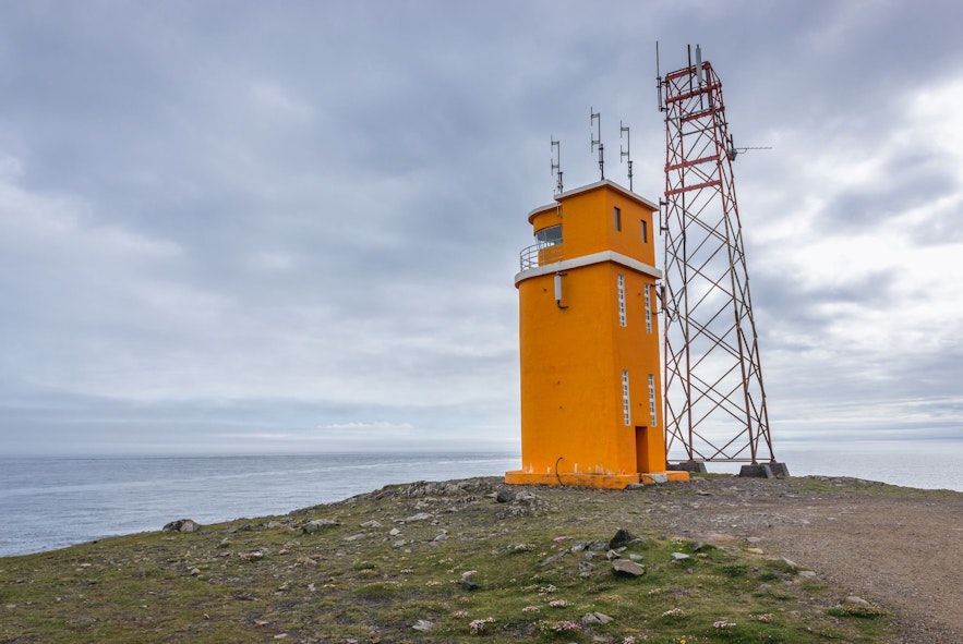 Hvalnes lighthouse contrasts the rugged natural surroundings