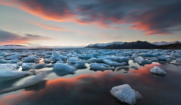 A sunset sky in summer reflecting perfectly off the jewel of Iceland's south, the Jökulsárlón Glacier Lagoon.