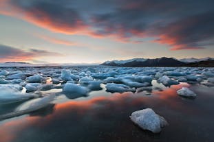 A sunset sky in summer reflecting perfectly off the jewel of Iceland's south, the Jökulsárlón Glacier Lagoon.