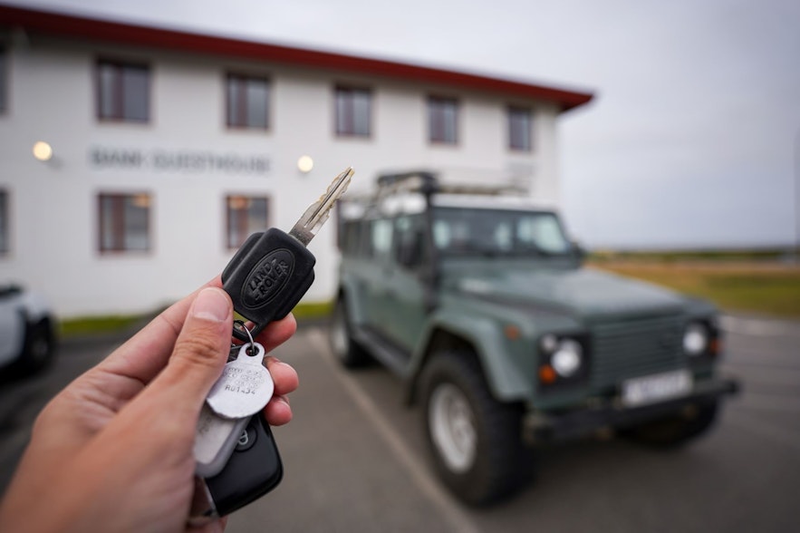 The key to a 4x4 vehicles with the car in the background.