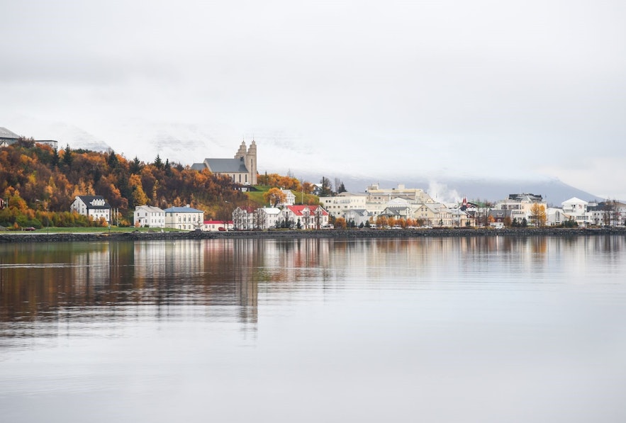 The Akureyri church and iconic buildings of the town nestle by the coast.