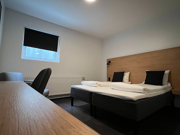 A room with a double bed, desk, and chair at 201 Hotel in Kopavogur.