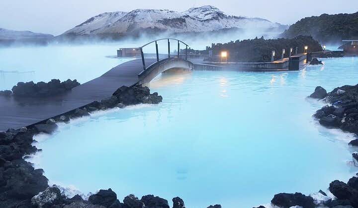 A bridge leads across the milky-blue waters of the Blue Lagoon geothermal spa in Southwest Iceland.