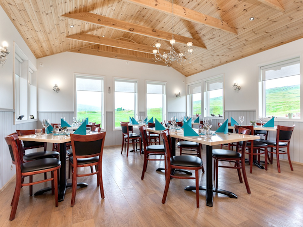 The on-site restaurant of Sireksstadir farm holiday has plenty of tables and chairs.