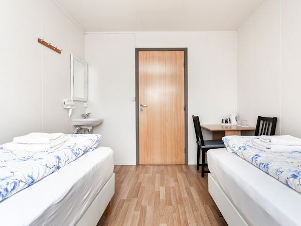 A room at Ferðaþjónustan Síreksstöðum with twin beds.