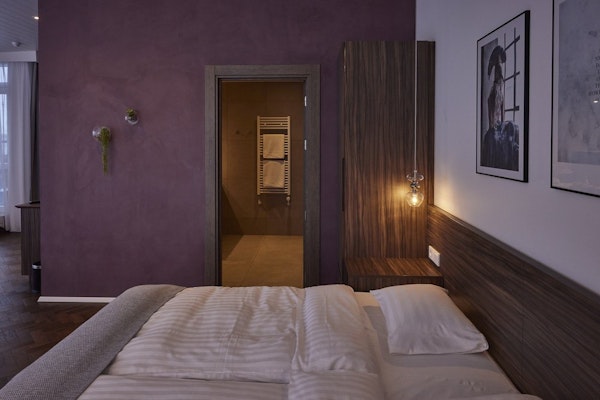A comfortable and elegant room at Hotel Vesturland with a private bathroom.