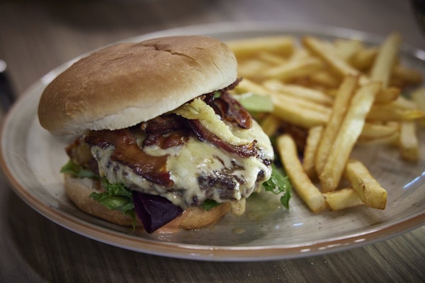 Order a delicious burger and chips at the restaurant in Hotel Vesturland.