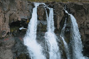 One of the 12 waterfalls featured in this 2.5-hour tour from Seydisfjordur.