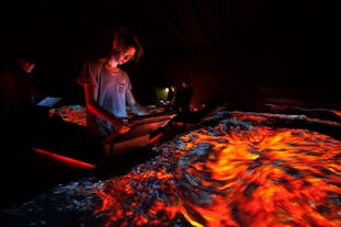 A guest at the Lava Centre in Iceland exploring one of its immersive exhibitions.