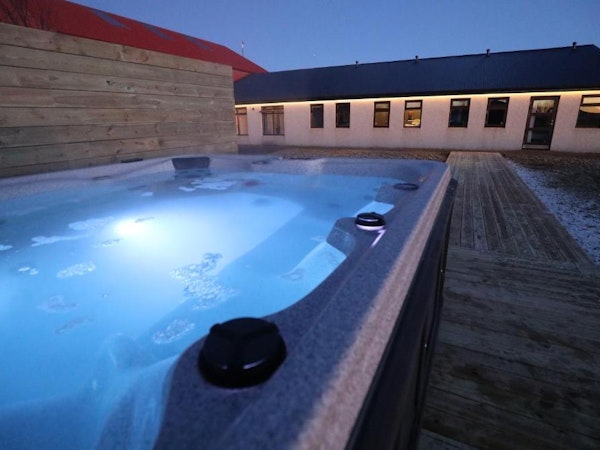 The outdoor jacuzzi at Deluxe Lodge is the perfect spot to unwind after a day's exploration.