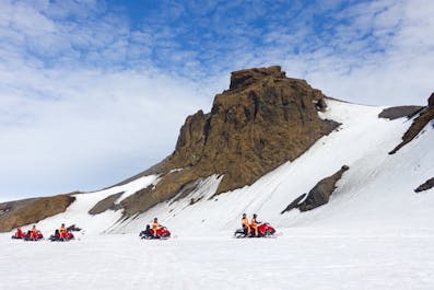 A group snowmobiling across the Langjokull glacier, Iceland's second largest glacier.
