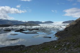 The tongue of the Hoffellsjokull glacier, flowing into a lagoon full of floating icebergs.