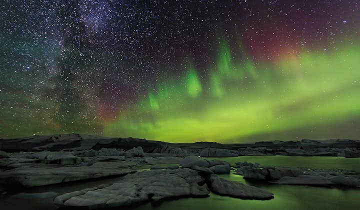 The Northern Lights dancing majestically over 'The Crown Jewel of Iceland' Jökulsárlón glacier lagoon.