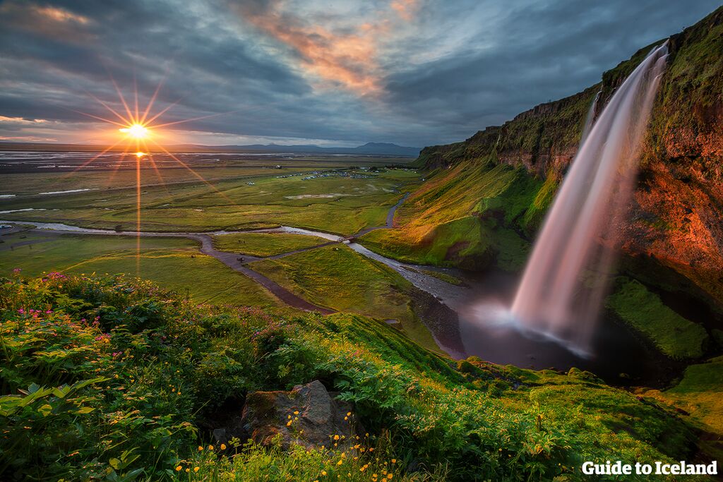 Seljalandsfoss waterfall on the South Coast of Icelands provides stunning views from behind the cascade.