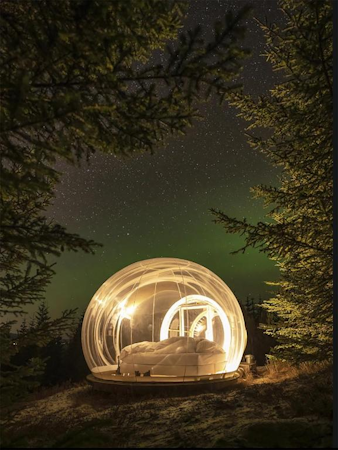 Each bubble at the Buubble Olvisholt lights up, adding to the majestic experience of sleeping under the stars.