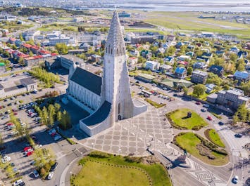 An overhead view of Reykjavik on a bright sunny day, with the Hallgrimskirkja church at its center.