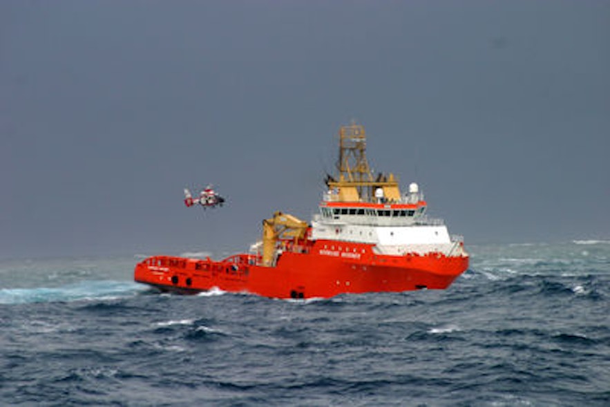 Icelandic air rescue team delivering a heart monitor to a ship