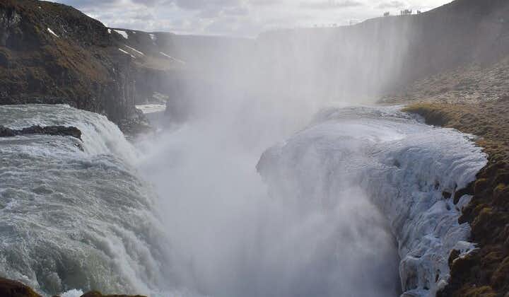 The misty splendor of Gullfoss waterfall seen from above, illustrating the raw beauty of Iceland’s nature.