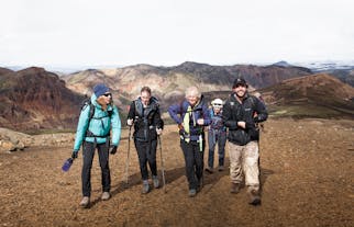 A group of people enjoy a guided hike through the Kerlingarfjoll mountain range in the Icelandic Highlands.