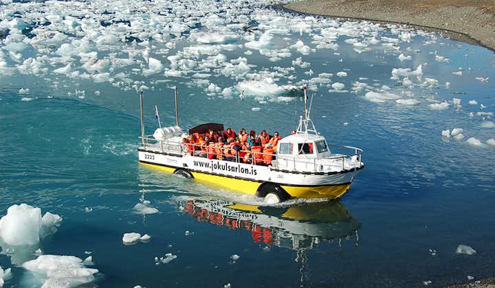 An amphibious boat cruises across the Jokulsarlon glacier lagoon.