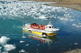 An amphibious boat cruises across the Jokulsarlon glacier lagoon.