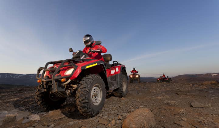 ATV riders crossing a rocky landscape in Southwest Iceland.