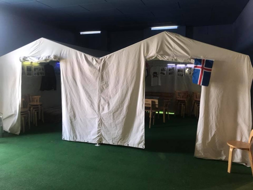 Visitors to the Sagnheimar Folk Museum can sit in a sample festival tent like the ones Icelanders use at this celebration each year.