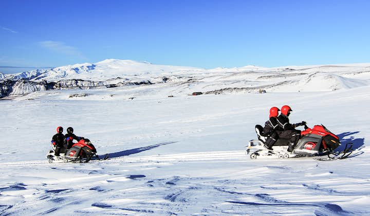 Snowmobiling tours require two riders per vehicle while zipping across Mýrdalsjökull Glacier.