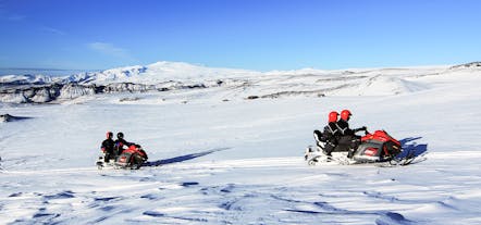 Snowmobiling tours require two riders per vehicle while zipping across Mýrdalsjökull Glacier.