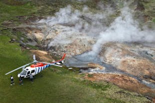 A helicopter landing on the geothermal area of Hengill in Southwest Iceland.