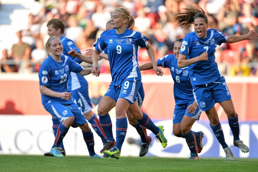 Icelandic women's football team members celebrating a goal