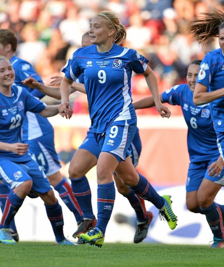 Icelandic women's football team members celebrating a goal