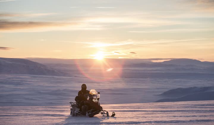 Hop on a snowmobile and start your journey across the glacier.