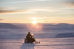 Hop on a snowmobile and start your journey across the glacier.