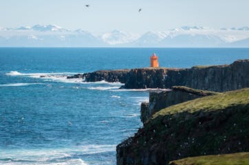 grimsey island north Iceland orange lighthouse ocean mountains shutterstock.jpg